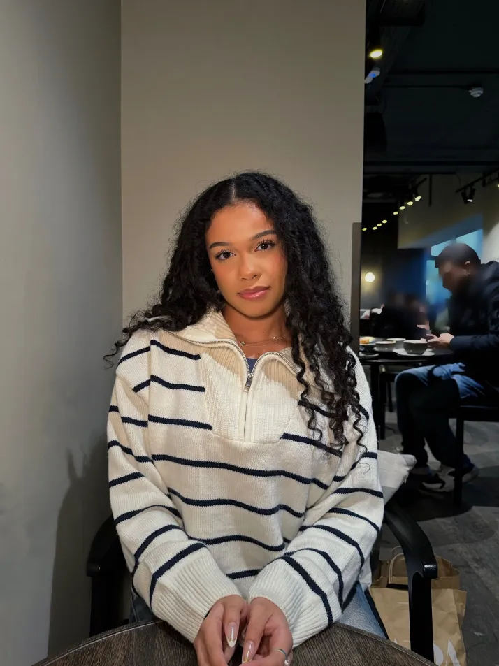 Woman working on laptop in cafe
